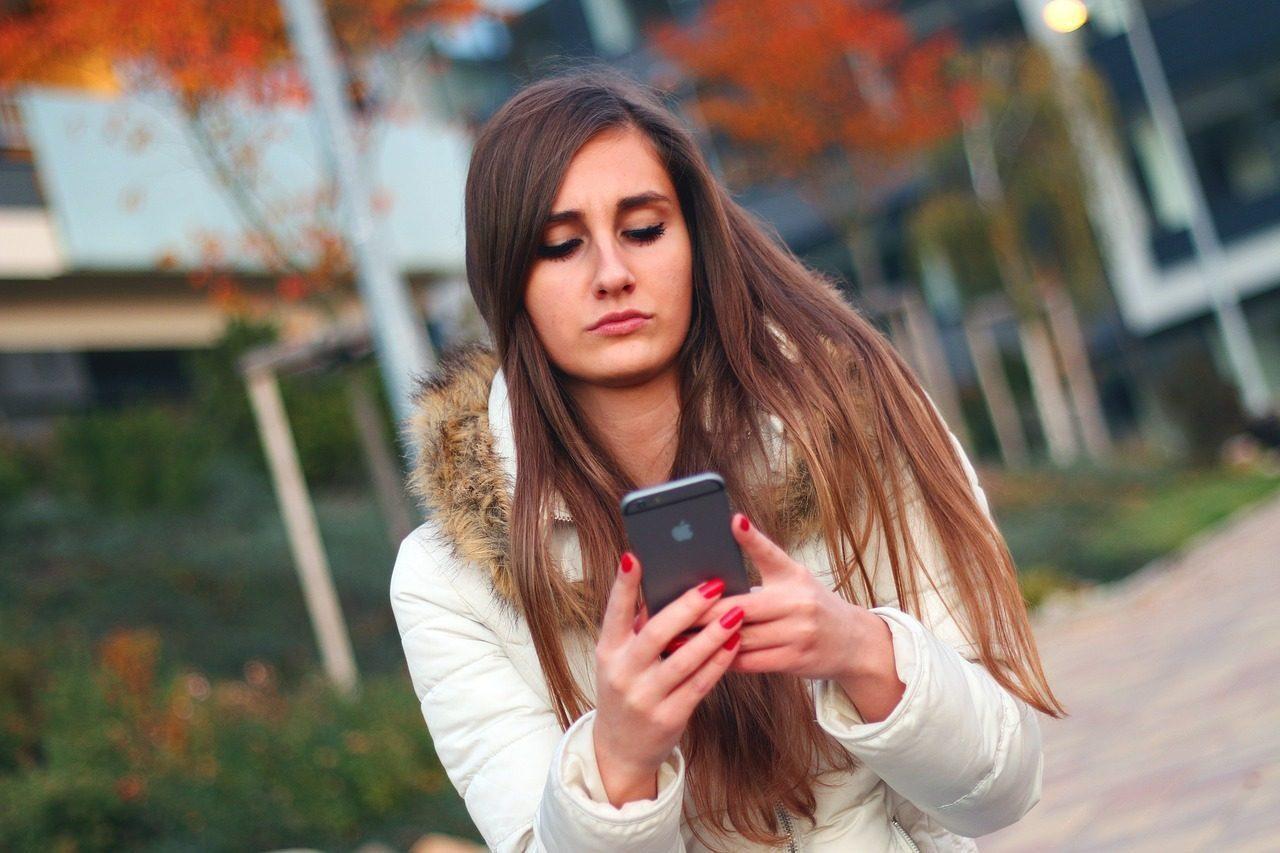 Woman uses slide right function on smart phone