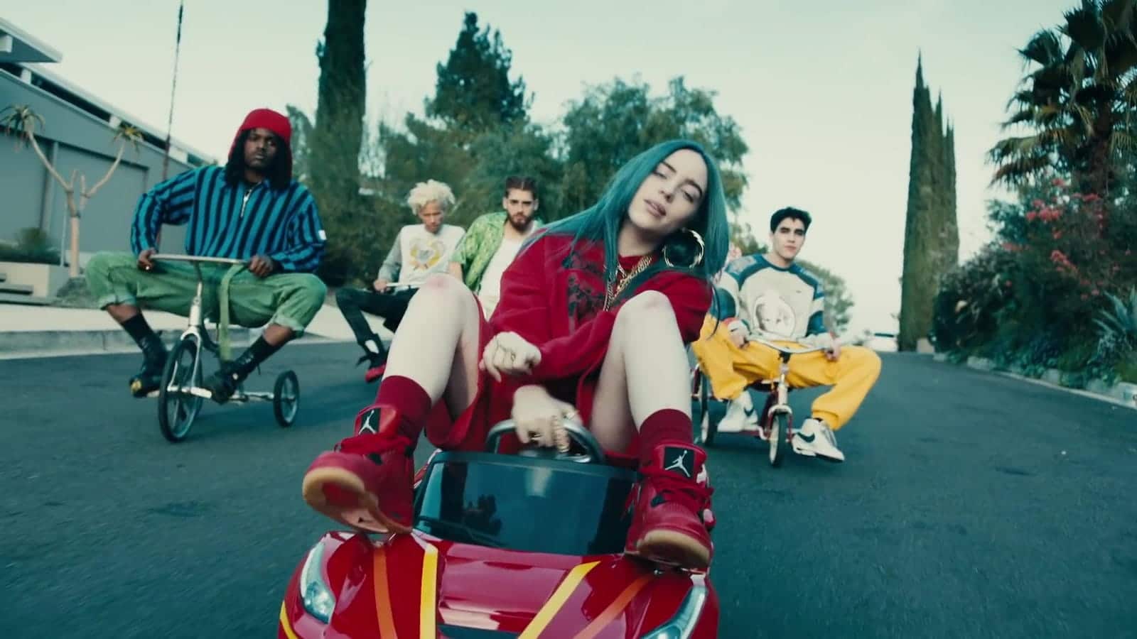 Billie Eilish rides a big wheel in her music video