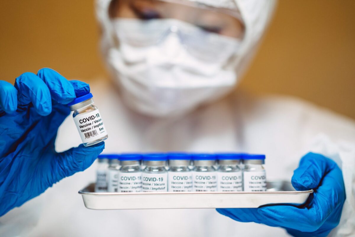 Why are government officials first in line for the COVID-19 vaccine?