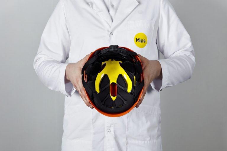 man holding helmet