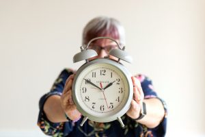 Journalist & PR consultant Fiona Scott holding an old-fashioned alarm clock Journalist & PR consultant Fiona Scott holding an old-fashioned alarm clock
