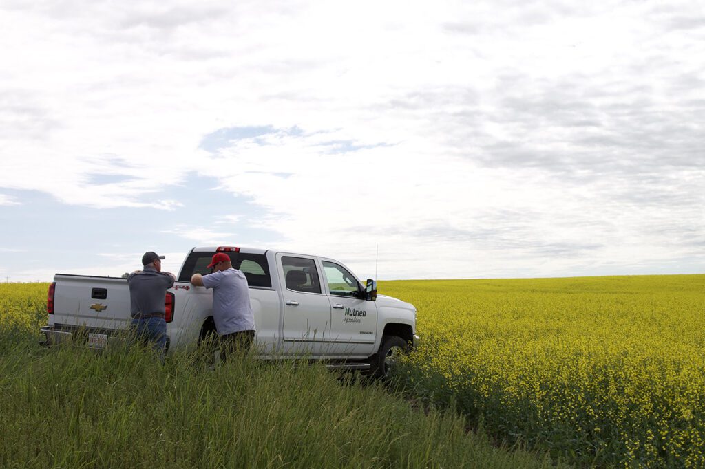 L-R: Nutrien Ag Solutions representative Craig Christensen with farmer Andy Stender on location in Calgary, Canada.