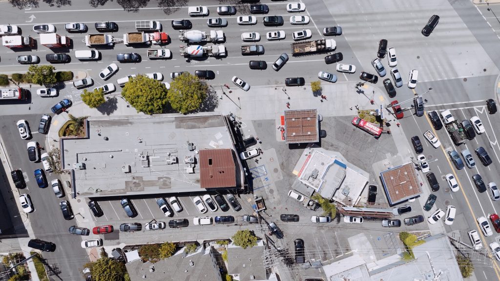 Aerial view of the Santa Monica Blvd. and Westwood Blvd. intersection with heavy traffic and numerous cars wrapped around the block waiting for their turn for free gas.