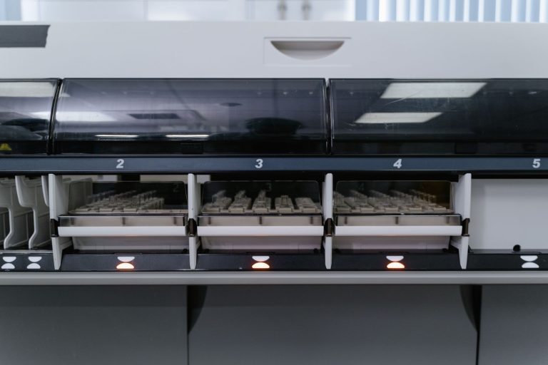 Automated laboratory machine analyzing multiple test samples in healthcare research facility