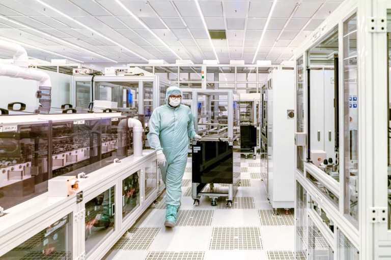 AI chips being manufactured in a clean room facility