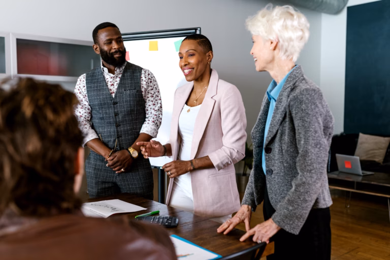 A diverse group of business professionals discussing strategy in a modern office