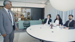 Professional business meeting with executives in a modern conference room