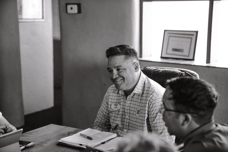 Executive leadership team in modern boardroom setting