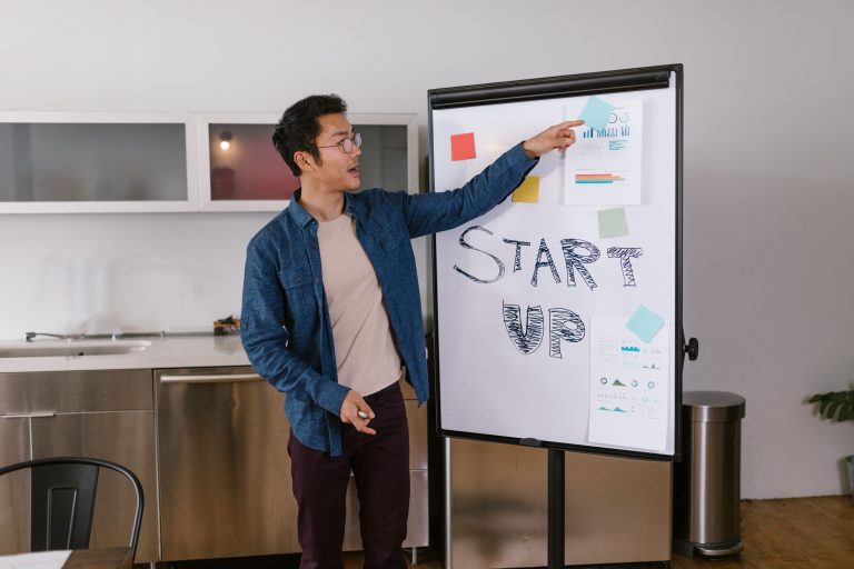 A founder presents a startup pitch on stage