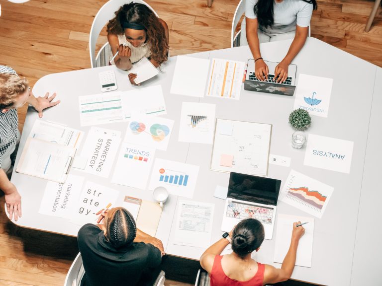 A marketing team planning strategy around a table