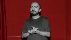 Higgsfield co-founder Alexander Mashrabov in front of a red background