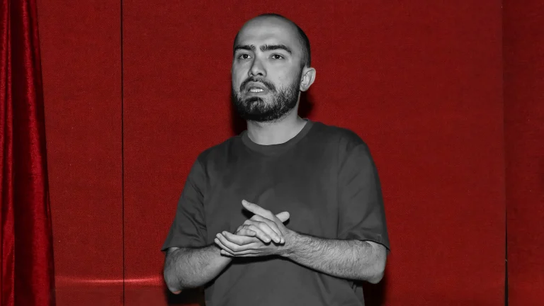 Higgsfield co-founder Alexander Mashrabov in front of a red background