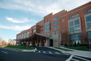 Modern hospital exterior under a clear sky