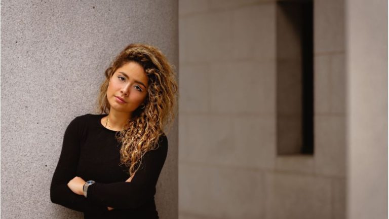 Kalder founder Gökçe Güven poses against a concrete wall