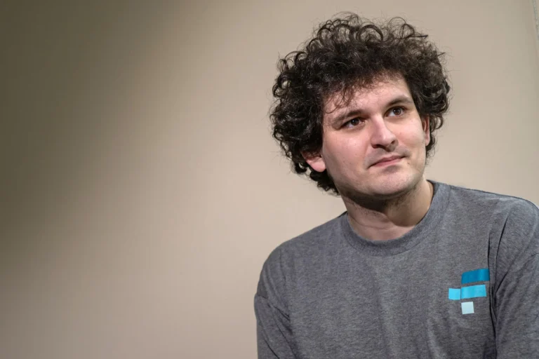 FTX cofounder Sam Bankman-Fried wearing a gray FTX T-shirt
