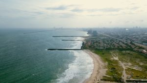An aerial view of Lagos coastline and buildings, illustrating the Nigerian setting
