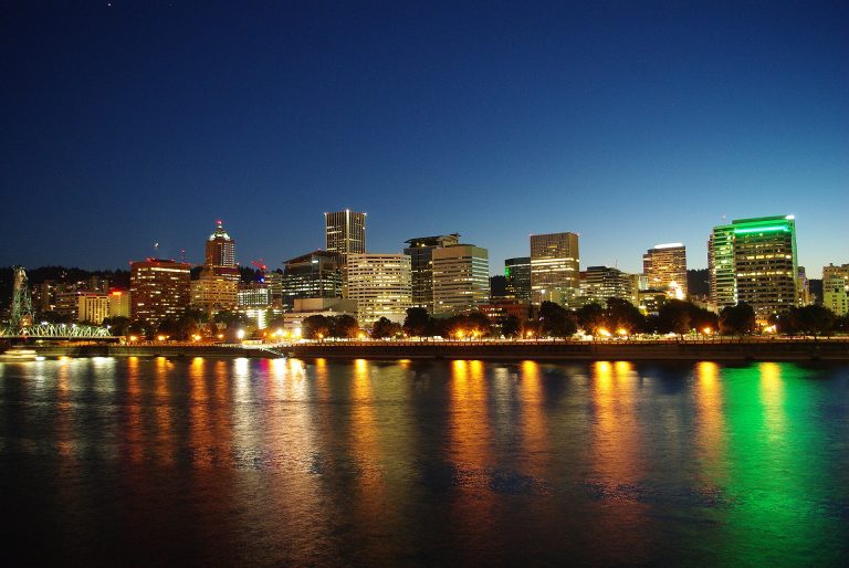 Portland skyline reflected in the Willamette River at night